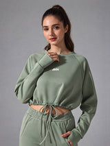 Zara-Flow Training Shirt in Green – women's long sleeve drawstring sports shirt