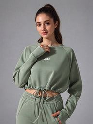 Zara-Flow Training Shirt in Green – women's long sleeve drawstring sports shirt