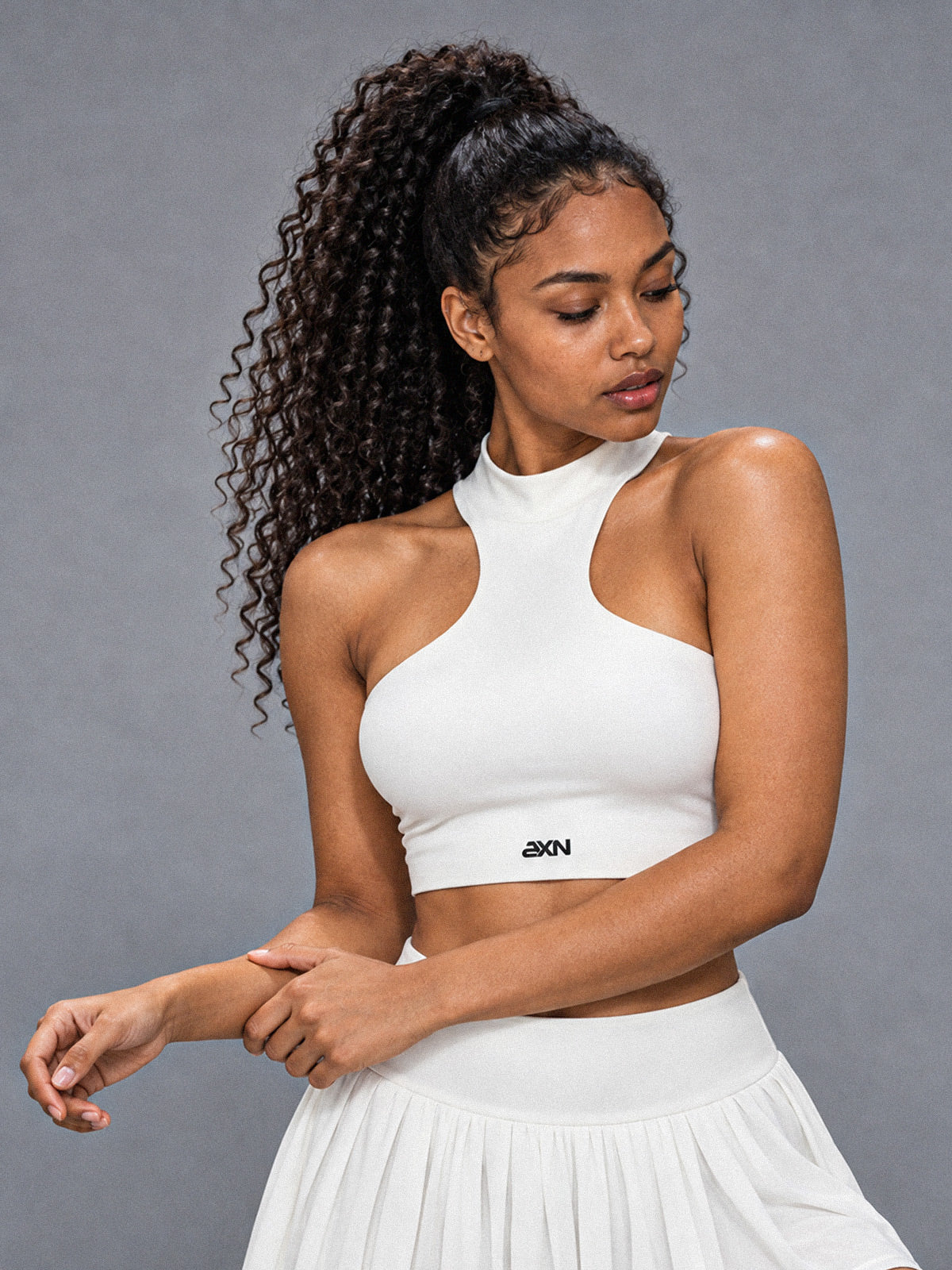 Lina-Asym Cut Top in White – women's asymmetric halter crop top