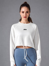 Zara-Flow Training Shirt in White – women's long sleeve drawstring sports shirt