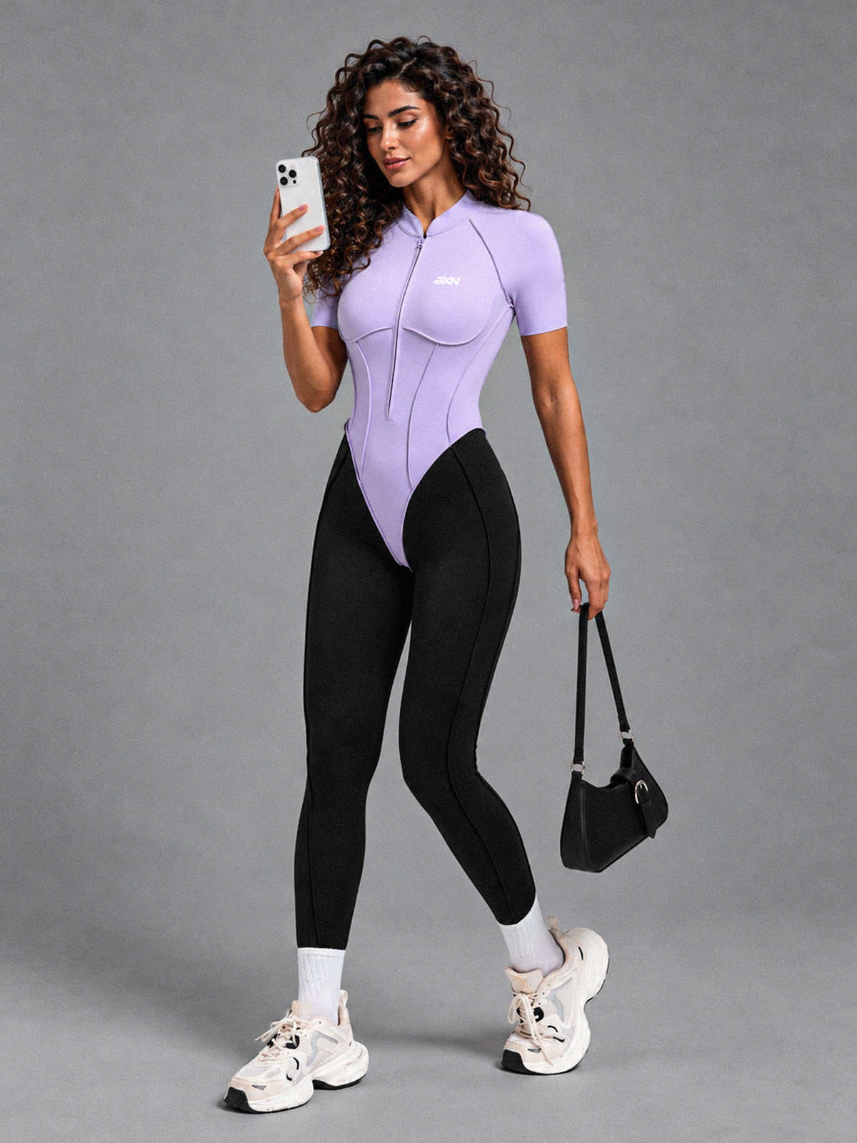 Luxe Zip Sculpt Jumpsuit in Purple – women's zip front workout jumpsuit