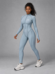 Nora-Zip Sculpt Suit in Sea Blue – women's long sleeve zip yoga bodysuit